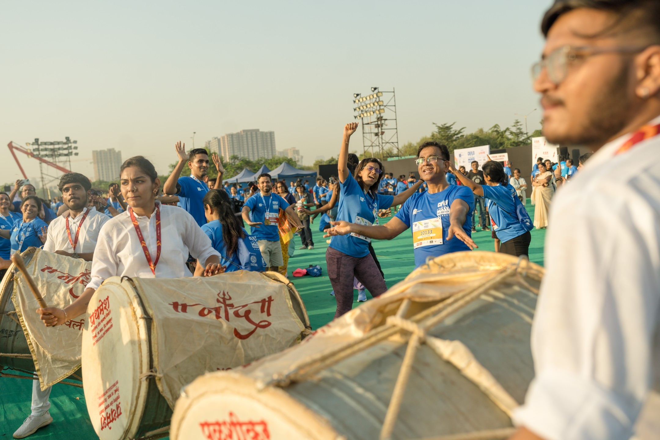 Dhol drummers and participants celebrating